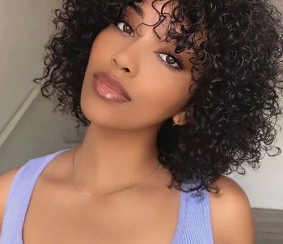 Transform your look with curly hair wigs: Natural-looking, voluminous curls in various lengths & colors for effortless style & confidence boost.